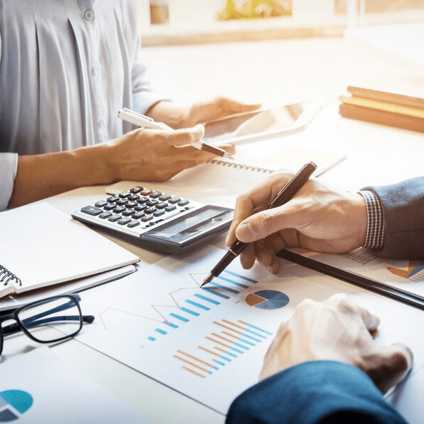 Businesspeople reviewing financial charts and data.